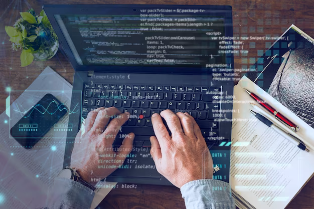 Hands typing code on a computer